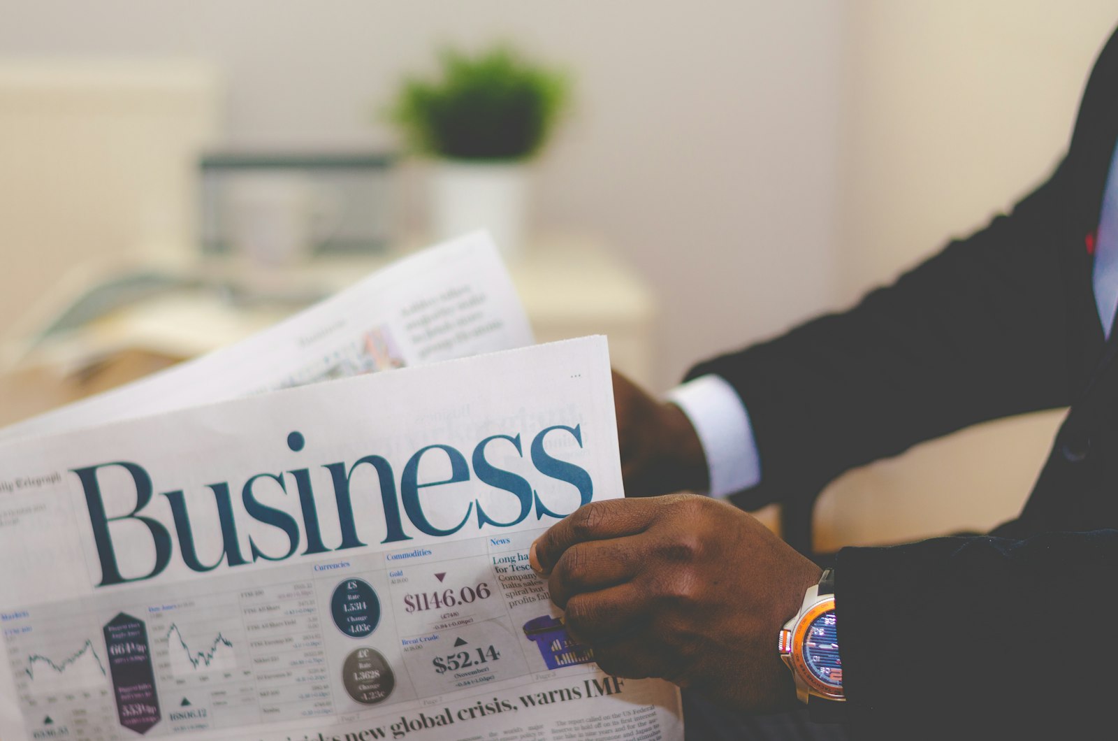 Businessman reading the business section of a newspaper