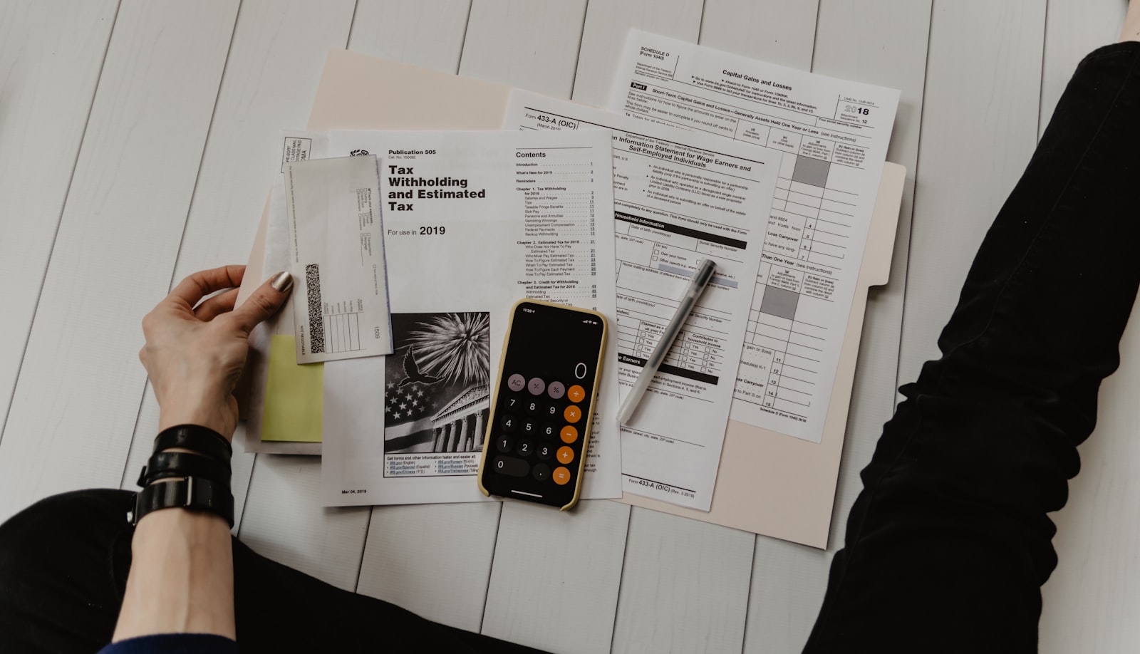 Desk with financial paperwork and a calculator